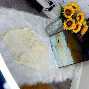 Cream colored shorts that ties up in the front